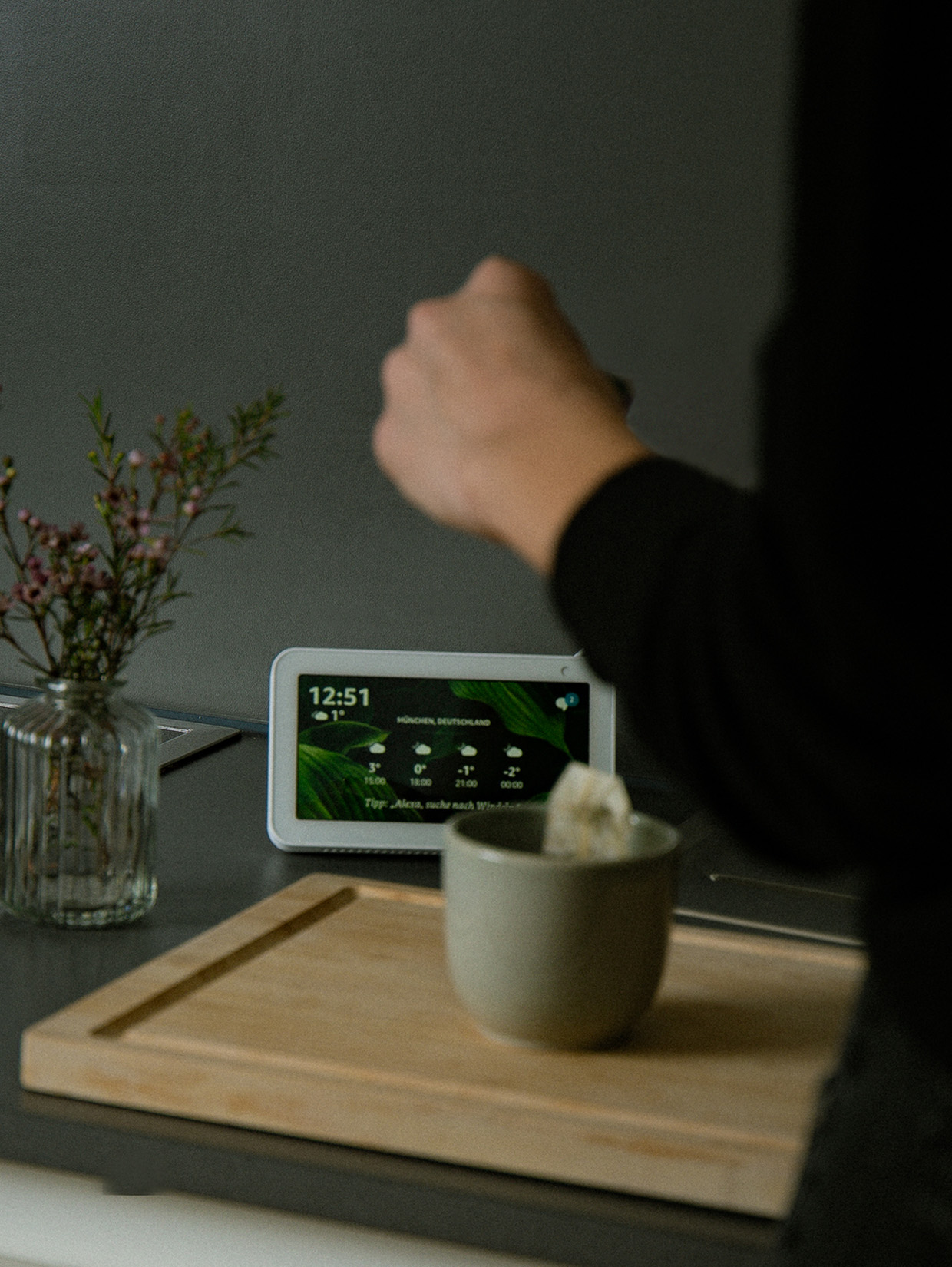 VUI.agency – Voice development – Amazon Alexa Voice Assitant, Echo show, placed on a table with person making tea and asking for the weather